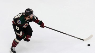 Apr 19, 2021; Glendale, Arizona, USA; Arizona Coyotes right wing Conor Garland (83) skates the puck against the Minnesota Wild during the third period at Gila River Arena. Mandatory Credit: Joe Camporeale-USA TODAY Sports