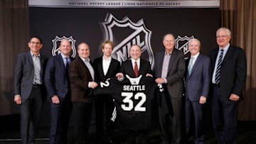 SEA ISLAND, GA - DECEMBER 04: (L to R) Adrian Hanauer, NHL Seattle franchise Vice-Chairman David Wright, Jay Deutsch, Jerry Bruckheimer, NHL Commissioner Gary Bettman, NHL Seattle franchise majority owner David Bonderman, Len Potter, and NHL Seattle franchise President and CEO Tod Leiweke pose for a photo during the NHL Board of Governors Meeting on December 4, 2018 in Sea Island, Georgia. The NHL Board of Governors approved expanding to Seattle, making the franchise the 32nd team in the league. (Photo by Patrick McDermott/NHLI via Getty Images)