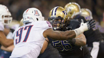 Oct 29, 2011; Seattle, WA, USA; Washington Huskies offensive tackle Senio Kelemete (56) blocks Arizona Wildcats defensive end Mohammed Usman (97) during the 1st half at Husky Stadium. Mandatory Credit: Steven Bisig-USA TODAY Sports