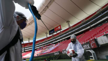 ZAPOPAN, MEXICO - JULY 12: Staff members of the Akron Stadium sanitize the balls before the match between Atlas and Tigres UANL as part of the friendship tournament Copa GNP por Mexico at Akron Stadium on July 12, 2020 in Zapopan, Mexico. (Photo by Refugio Ruiz/Getty Images)