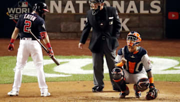 WASHINGTON, DC - OCTOBER 27: Adam Eaton #2 of the Washington Nationals speaks with umpire Lance Barksdale #23 after striking out against the Houston Astros during the fourth inning in Game Five of the 2019 World Series at Nationals Park on October 27, 2019 in Washington, DC. (Photo by Win McNamee/Getty Images)