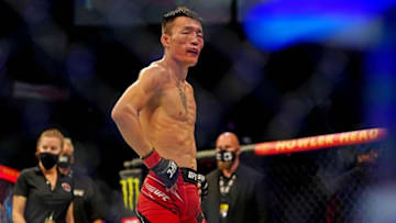 Apr 24, 2021; Jacksonville, Florida, USA; Aoriqileng (Red Gloves) reacts after fighting Jeff Molina (Blue Gloves) during UFC 261 at VyStar Veterans Memorial Arena. Mandatory Credit: Jasen Vinlove-USA TODAY Sports
