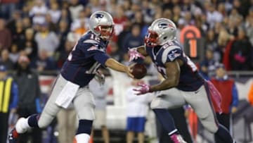 Oct 5, 2014; Foxborough, MA, USA; New England Patriots quarterback Tom Brady (12) hands off the ball to New England Patriots running back Stevan Ridley (22) against the Cincinnati Bengals during the first quarter at Gillette Stadium. Mandatory Credit: David Butler II-USA TODAY Sports