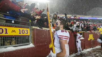Nov 30, 2019; Minneapolis, MN, USA; Wisconsin Badgers tight end Jake Ferguson (84) celebrates with the Paul Bunyan Axe Trophy after defeating the Minnesota Golden Gophers at TCF Bank Stadium. Mandatory Credit: Jesse Johnson-USA TODAY Sports