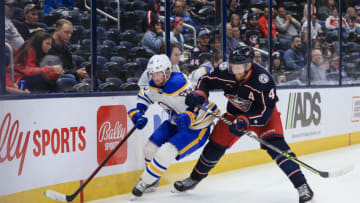 Sep 28, 2022; Columbus, Ohio, USA; Buffalo Sabres left wing Linus Weissbach (65) skates for the puck against Columbus Blue Jackets defenseman Vladislav Gavrikov (4) in the third period at Nationwide Arena. Mandatory Credit: Aaron Doster-USA TODAY Sports