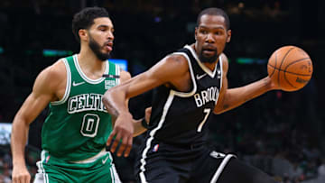 BOSTON, MA - MARCH 06: Kevin Durant #7 of the Brooklyn Nets drives to the basket past Jayson Tatum #0 of the Boston Celtics during a game at TD Garden on March 6, 2022 in Boston, Massachusetts. NOTE TO USER: User expressly acknowledges and agrees that, by downloading and or using this photograph, User is consenting to the terms and conditions of the Getty Images License Agreement. (Photo by Adam Glanzman/Getty Images)