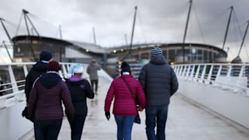 MANCHESTER, ENGLAND - DECEMBER 22: Fans arrive at the stadium prior to the Premier League match between Manchester City and Crystal Palace at Etihad Stadium on December 22, 2018 in Manchester, United Kingdom. (Photo by Jan Kruger/Getty Images)