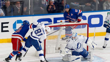 NEW YORK, NY - FEBRUARY 02: Louis Domingue #70 of the Tampa Bay Lightning tends the net as Erik Cernak #81 defends against Chris Kreider #20 of the New York Rangers at Madison Square Garden on February 2, 2019 in New York City. (Photo by Jared Silber/NHLI via Getty Images)