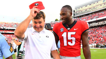 ATHENS, GA - SEPTEMBER 29: Head Coach Kirby Smart of the Georgia Bulldogs heads off the field with DAndre Walker #15 after the game against the Tennessee Volunteers on September 29, 2018 at Sanford Stadium in Athens, Georgia. (Photo by Scott Cunningham/Getty Images)
