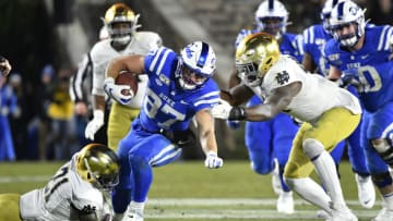 DURHAM, NORTH CAROLINA - NOVEMBER 09: Jalen Elliott #21 of the Notre Dame Fighting Irish tackles Noah Gray #87 of the Duke Blue Devils during the second half of their game at Wallace Wade Stadium on November 09, 2019 in Durham, North Carolina. (Photo by Grant Halverson/Getty Images)