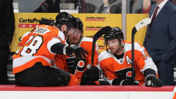 PHILADELPHIA, PA - JANUARY 07: Claude Giroux #28, Travis Konecny #11 and Sean Couturier #14 of the Philadelphia Flyers discus a play on the bench against the St Louis Blues on January 7, 2019 at the Wells Fargo Center in Philadelphia, Pennsylvania. (Photo by Len Redkoles/NHLI via Getty Images)