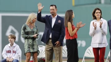 May 20, 2016; Boston, MA, USA; 2016 Red Sox Hall of Fame inductee Tim Wakefield waves to the crowd before throwing out the first pitch with fellow inductees Larry Lucchino and Jason Varitek (not pictured) before the start of the game against the Cleveland Indians at Fenway Park. Mandatory Credit: David Butler II-USA TODAY Sports