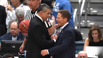 Head coach Frank Martin (L) of the South Carolina Gamecocks talks with head coach Mark Few of the Gonzaga Bulldogs. (Photo by Lance King/Getty Images)