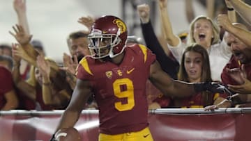 Sep 12, 2015; Los Angeles, CA, USA; Southern California Trojans receiver JuJu Smith-Schuster (9) celebrates with fans after scoring on a 41-yard touchdown reception in the third quarter against the Idaho Vandals at Los Angeles Memorial Coliseum. Mandatory Credit: Kirby Lee-USA TODAY Sports