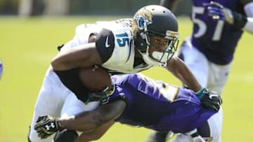 Sep 25, 2016; Jacksonville, FL, USA; Jacksonville Jaguars wide receiver Allen Robinson (15) runs as Baltimore Ravens free safety Lardarius Webb (21) makes the tackle during the second quarter of a football game at EverBank Field. Mandatory Credit: Reinhold Matay-USA TODAY Sports