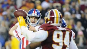 Nov 29, 2015; Landover, MD, USA; New York Giants quarterback Eli Manning (10) throws the ball against the Washington Redskins during the second half at FedEx Field. The Redskins won 20-14. Mandatory Credit: Brad Mills-USA TODAY Sports