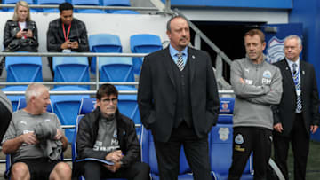 CARDIFF, WALES - AUGUST 18: Newcastle United Manager Rafael Benitez (C) stands in the dugouts during the Premier League Match between Cardiff City and Newcastle United at the Cardiff City Stadium on August 18, 2018, in Cardiff, Wales. (Photo by Serena Taylor/Newcastle United via Getty Images)