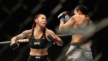 INGLEWOOD, CA - DECEMBER 29: Cris Cyborg of Brazil (left) is punched by Amanda Nunes (right) during a Women's Feather weight bout during the UFC 232 event inside The Forum on December 29, 2018 in Inglewood, California. (Photo by Sean M. Haffey/Getty Images)
