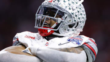 ATLANTA, GEORGIA - DECEMBER 31: Xavier Johnson #10 of the Ohio State Buckeyes reacts after a touchdown during the second quarter against the Georgia Bulldogs in the Chick-fil-A Peach Bowl at Mercedes-Benz Stadium on December 31, 2022 in Atlanta, Georgia. (Photo by Todd Kirkland/Getty Images)