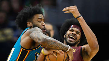 Feb 8, 2023; Cleveland, Ohio, USA; Detroit Pistons forward Saddiq Bey (41) forces a jump ball with Cleveland Cavaliers center Jarrett Allen (31) in the third quarter at Rocket Mortgage FieldHouse. Mandatory Credit: David Richard-USA TODAY Sports