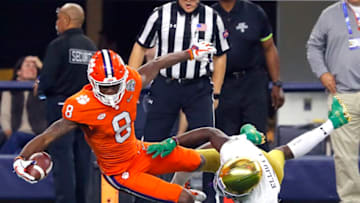 ARLINGTON, TEXAS - DECEMBER 29: Justyn Ross #8 of the Clemson Tigers catches a touchdown pass in the second quarter against Jalen Elliott #21 of the Notre Dame Fighting Irish during the College Football Playoff Semifinal Goodyear Cotton Bowl Classic at AT&T Stadium on December 29, 2018 in Arlington, Texas. (Photo by Kevin C. Cox/Getty Images)