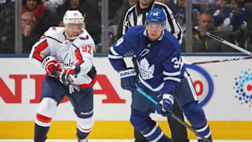 Evgeny Kuznetsov #92 of the Washington Capitals skates against Auston Matthews #34 of the Toronto Maple Leafs during an NHL game at Scotiabank Arena. (Photo by Claus Andersen/Getty Images)