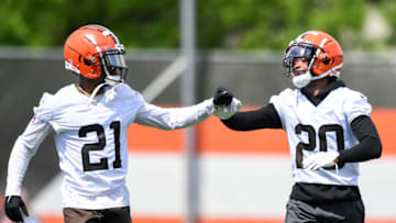 BEREA, OH - JUNE 01: Denzel Ward #21 and Greg Newsome II #20 of the Cleveland Browns celebrate a play during the Cleveland Browns offseason workout at CrossCountry Mortgage Campus on June 1, 2022 in Berea, Ohio. (Photo by Nick Cammett/Getty Images)