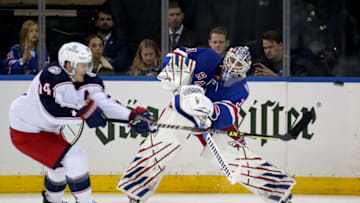 Oct 29, 2021; New York, New York, USA; New York Rangers goaltender Igor Shesterkin (31) plays the puck past Columbus Blue Jackets center Gustav Nyquist (14) during the second period at Madison Square Garden. Mandatory Credit: Brad Penner-USA TODAY Sports