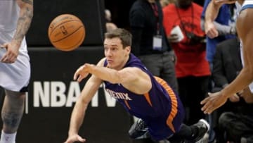 Jan 8, 2014; Minneapolis, MN, USA; Phoenix Suns guard Goran Dragic (1) dives for a loose ball during the third quarter against the Minnesota Timberwolves at Target Center. The Suns defeated the Timberwolves 104-103. Mandatory Credit: Brace Hemmelgarn-USA TODAY Sports