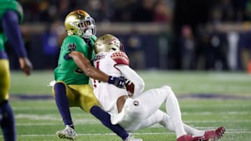 SOUTH BEND, IN - NOVEMBER 10: Julian Love #27 of the Notre Dame Fighting Irish tackles George Campbell #11 of the Florida State Seminoles in the second quarter of the game at Notre Dame Stadium on November 10, 2018 in South Bend, Indiana. (Photo by Joe Robbins/Getty Images)