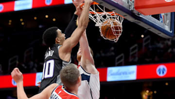 WASHINGTON, DC - NOVEMBER 24: Justin James #10 of the Sacramento Kings dunks in front of Davis Bertans #42 of the Washington Wizards during the first half at Capital One Arena on November 24, 2019 in Washington, DC. NOTE TO USER: User expressly acknowledges and agrees that, by downloading and or using this photograph, User is consenting to the terms and conditions of the Getty Images License Agreement. (Photo by Will Newton/Getty Images)