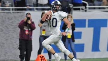Hudsonville Unity Christian Isaac TeSlaa (10) scampers into the end-zone
