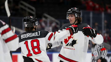 EDMONTON, AB - DECEMBER 26: Xavier Bourgault #18 and Owen Power #25 of Canada celebrate a goal against Czechia in the first period during the 2022 IIHF World Junior Championship at Rogers Place on December 26, 2021 in Edmonton, Canada. (Photo by Codie McLachlan/Getty Images)