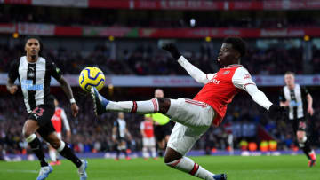 LONDON, ENGLAND - FEBRUARY 16: Bukayo Saka of Arsenal stretches for the ball during the Premier League match between Arsenal FC and Newcastle United at Emirates Stadium on February 16, 2020 in London, United Kingdom. (Photo by Justin Setterfield/Getty Images)