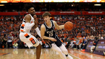 SYRACUSE, NEW YORK - FEBRUARY 01: Quincy Guerrier #1 of the Syracuse Orange guards Alex O'Connell #15 of the Duke Blue Devils during the first half of an NCAA basketball game at the Carrier Dome on February 01, 2020 in Syracuse, New York. (Photo by Bryan M. Bennett/Getty Images)