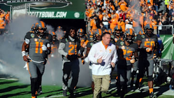 Dec 30, 2016; Nashville , TN, USA; Tennessee Volunteers head coach Butch Jones leads his team onto the field before the Music City Bowl against the Nebraska Cornhuskers at Nissan Stadium. Mandatory Credit: Christopher Hanewinckel-USA TODAY Sports