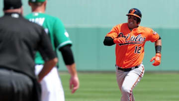 Mar 17, 2016; Fort Myers, FL, USA; Baltimore Orioles outfielder Dariel Alvarez (12) runs for a triple during the game against the Boston Red Sox at JetBlue Park. The Boston Red Sox won 9-5. Mandatory Credit: Evan Habeeb-USA TODAY Sports