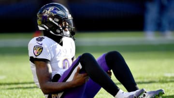 CLEVELAND, OHIO - DECEMBER 12: Lamar Jackson #8 of the Baltimore Ravens stays down on the field after suffering an injury in the first half against the Cleveland Browns at FirstEnergy Stadium on December 12, 2021 in Cleveland, Ohio. (Photo by Jason Miller/Getty Images)
