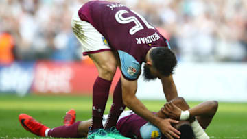 LONDON, ENGLAND - MAY 26: Mile Jedinak of Aston Villa consoles Jonathan Kodija of Aston Villa following their sides defeat in the Sky Bet Championship Play Off Final between Aston Villa and Fulham at Wembley Stadium on May 26, 2018 in London, England. (Photo by Clive Mason/Getty Images)