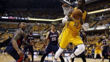 Apr 19, 2014; Indianapolis, IN, USA; Indiana Pacers center Roy Hibbert (55) saves a ball from going out of bounds against Atlanta Hawks guard Jeff Teague (0) in game one during the first round of the 2014 NBA Playoffs at Bankers Life Fieldhouse. Atlanta defeats Indiana 101-93. Mandatory Credit: Brian Spurlock-USA TODAY Sports