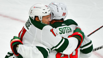 May 28, 2021; Las Vegas, Nevada, USA;Minnesota Wild left wing Zach Parise (11) celebrates with Minnesota Wild defenseman Ryan Suter (20) after scoring a first period goal against the Vegas Golden Knights in game seven of the first round of the 2021 Stanley Cup Playoffs at T-Mobile Arena. Mandatory Credit: Stephen R. Sylvanie-USA TODAY Sports