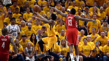 SALT LAKE CITY, UT - MAY 06: Donovan Mitchell #45 of the Utah Jazz goes to the basket under the defense of James Harden #13 of the Houston Rockets in the second half during Game Four of Round Two of the 2018 NBA Playoffs at Vivint Smart Home Arena on May 6, 2018 in Salt Lake City, Utah. The Rockets beat the Jazz 100-87. NOTE TO USER: User expressly acknowledges and agrees that, by downloading and or using this photograph, User is consenting to the terms and conditions of the Getty Images License Agreement. (Photo by Gene Sweeney Jr./Getty Images)