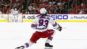 RALEIGH, NORTH CAROLINA - MAY 26: Mika Zibanejad #93 of the New York Rangers celebrates his powerplay goal at 17:03 of the first period against the Carolina Hurricanes in Game Five of the Second Round of the 2022 Stanley Cup Playoffs at PNC Arena on May 26, 2022 in Raleigh, North Carolina. (Photo by Bruce Bennett/Getty Images)