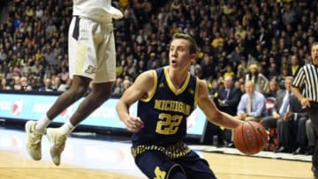 Jan 7, 2016; West Lafayette, IN, USA; Michigan Wolverines guard Duncan Robinson (22) drives past Purdue Boilermakers guard Johnny Hill (1) in the second half at Mackey Arena. Purdue won the game 87-70. Mandatory Credit: Sandra Dukes-USA TODAY Sports
