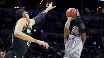 Mar 23, 2014; San Antonio, TX, USA; Creighton Bluejays guard Austin Chatman (1) shoots against Baylor Bears center Isaiah Austin (21) in the first half of a men
