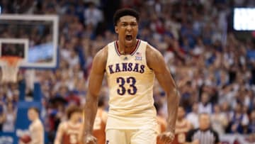 Kansas senior forward David McCormack (33) lets out a yell after Kansas takes the lead in overtime of Saturday's game against Texas inside Allen Fieldhouse.