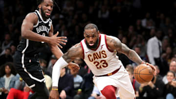 NEW YORK, NY - MARCH 25: LeBron James NEW YORK, NY - MARCH 25: LeBron James #23 of the Cleveland Cavaliers dribbles to the basket against DeMarre Carroll #9 of the Brooklyn Nets in the third quarter during their game at Barclays Center on March 25, 2018 in the Brooklyn borough of New York City. NOTE TO USER: User expressly acknowledges and agrees that, by downloading and or using this photograph, User is consenting to the terms and conditions of the Getty Images License Agreement. (Photo by Abbie Parr/Getty Images)