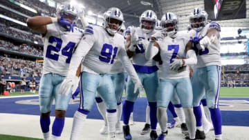 ARLINGTON, TEXAS - NOVEMBER 14: The Dallas Cowboys defense celebrate an interception by Trevon Diggs #7 of the Dallas Cowboys against the Atlanta Falcons during the third quarter at AT&T Stadium on November 14, 2021 in Arlington, Texas. (Photo by Tom Pennington/Getty Images)