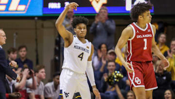 Feb 29, 2020; Morgantown, West Virginia, USA; West Virginia Mountaineers guard Miles McBride (4) celebrates after making a three pointer during the first half against the Oklahoma Sooners at WVU Coliseum. Mandatory Credit: Ben Queen-USA TODAY Sports