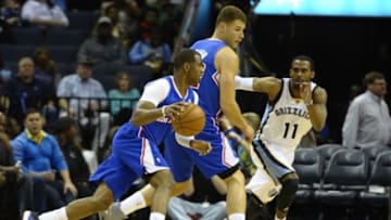 Feb 21, 2014; Memphis, TN, USA; Los Angeles Clippers point guard Chris Paul (3) dribbles the ball as Memphis Grizzlies point guard Mike Conley (11) chases during the first quarter at FedExForum. Mandatory Credit: Justin Ford-USA TODAY Sports